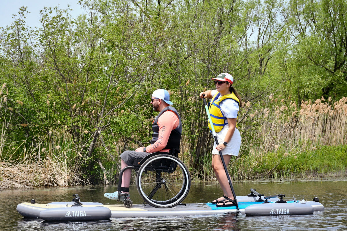 Two paddlers on the TAIGA Adaptive SUP