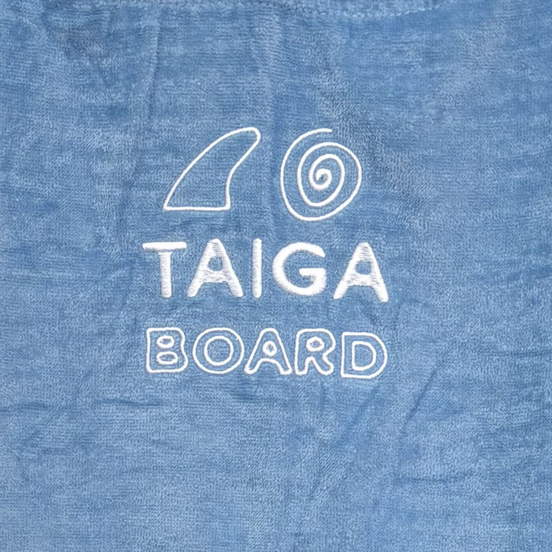 Blue fabric with white 'TAIGA BOARD' logo