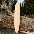 Front View of The Longboard Surf Board in The Rosé Color
