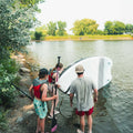 Paddlers holding the Sequoia Air 13'6" Light Construction