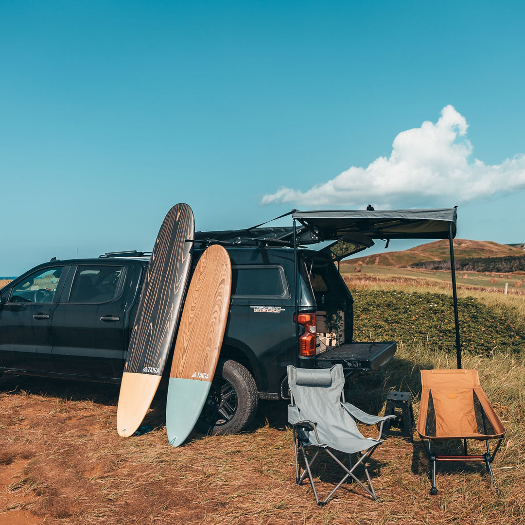Longboard 9'0" Surf Board Leaning on a Camping VAN 