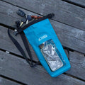 TAIGA Lake Blue Phone Dry Bag with a phone & keys inserted