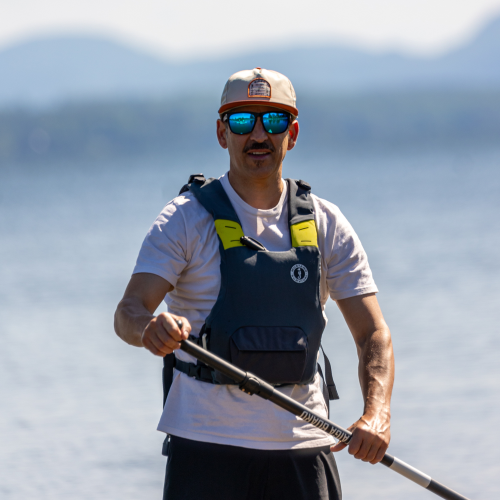 Paddler with the PFD Vest by MUSTANG - Grey