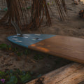 Wooden surfboard in the shade