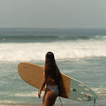 Girl holding a surfboard