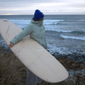 Surfer holding board