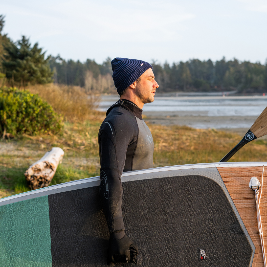 Paddler wearing the TAIGA BOARD BEANIE - Dark Blue