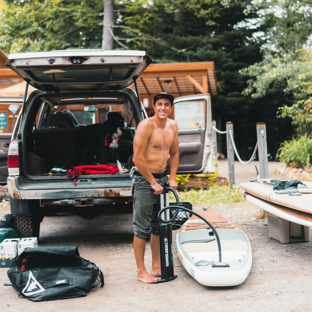 Paddler pumping with the Manual Pump - Triple Action - HP6 - 30 PSI